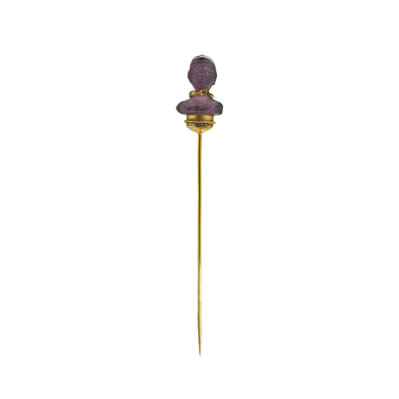 A 19th century French? gold and amethyst set stick pin, the stone carved as the bust of a lady, wearing a necklace